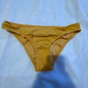 Mustard yellow bikini bottom.